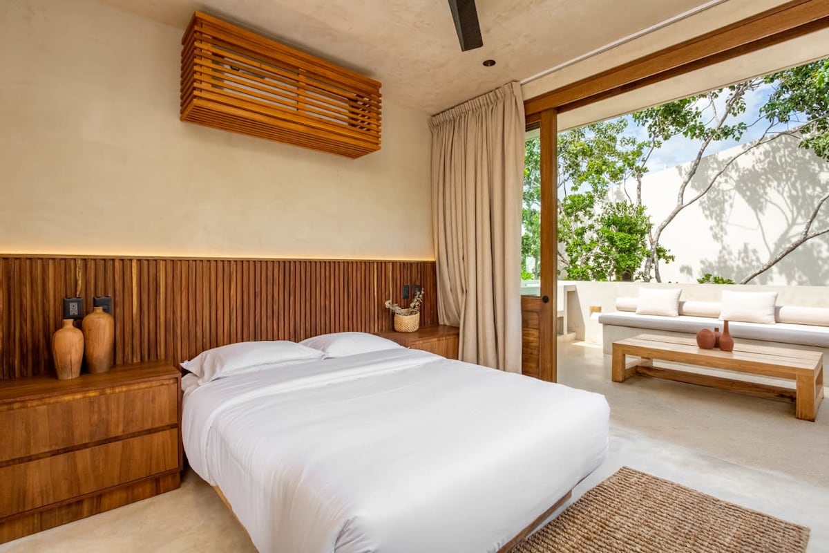 Master bedroom with king bed and jungle views at Luxury Jungle VIBE Tulum