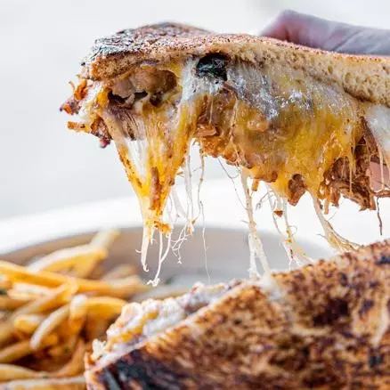 Beef birria sandwich with melted Manchego at Cidro Tulum