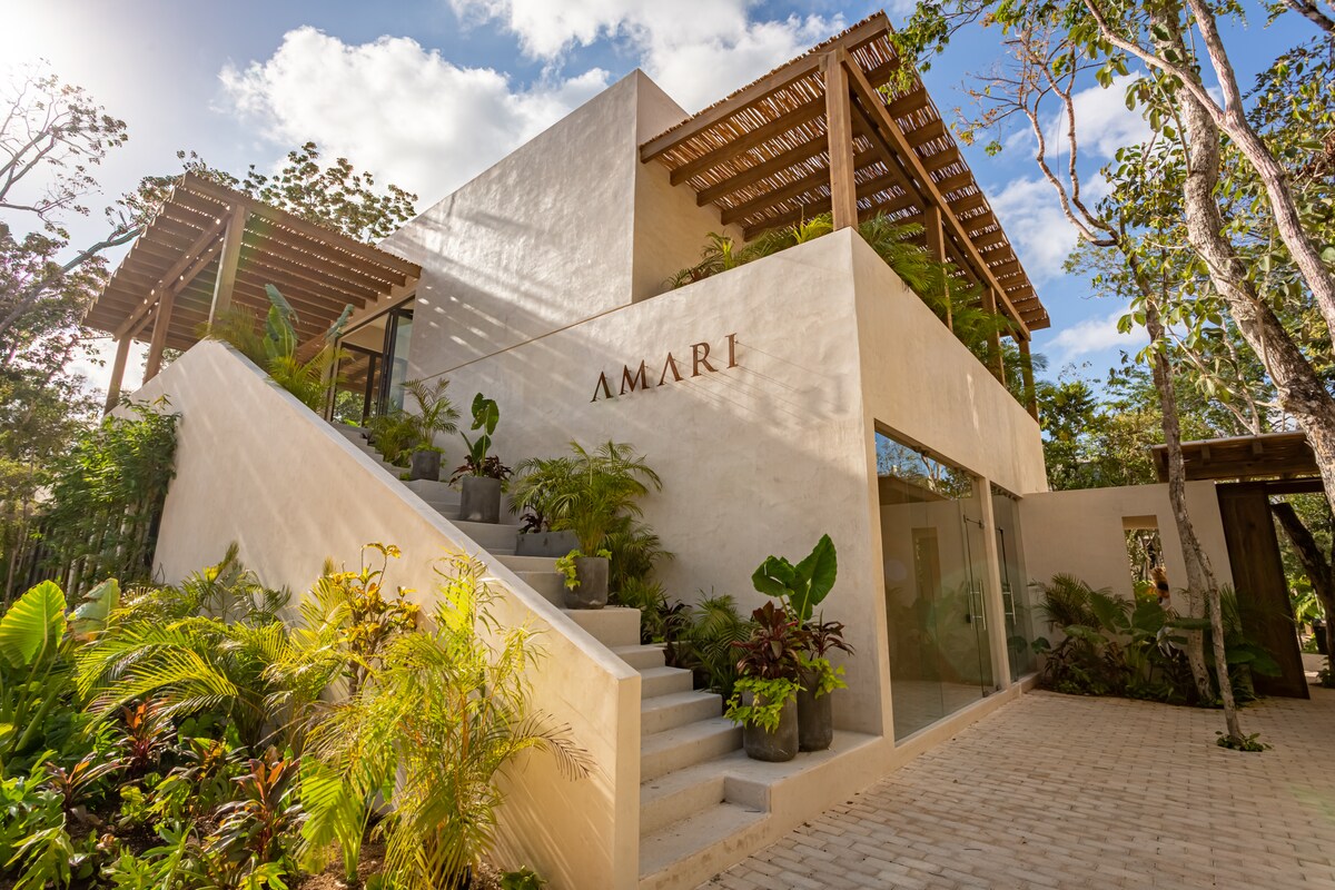 AMARI Uptown Tulum building with exterior staircase and AMARI lettering