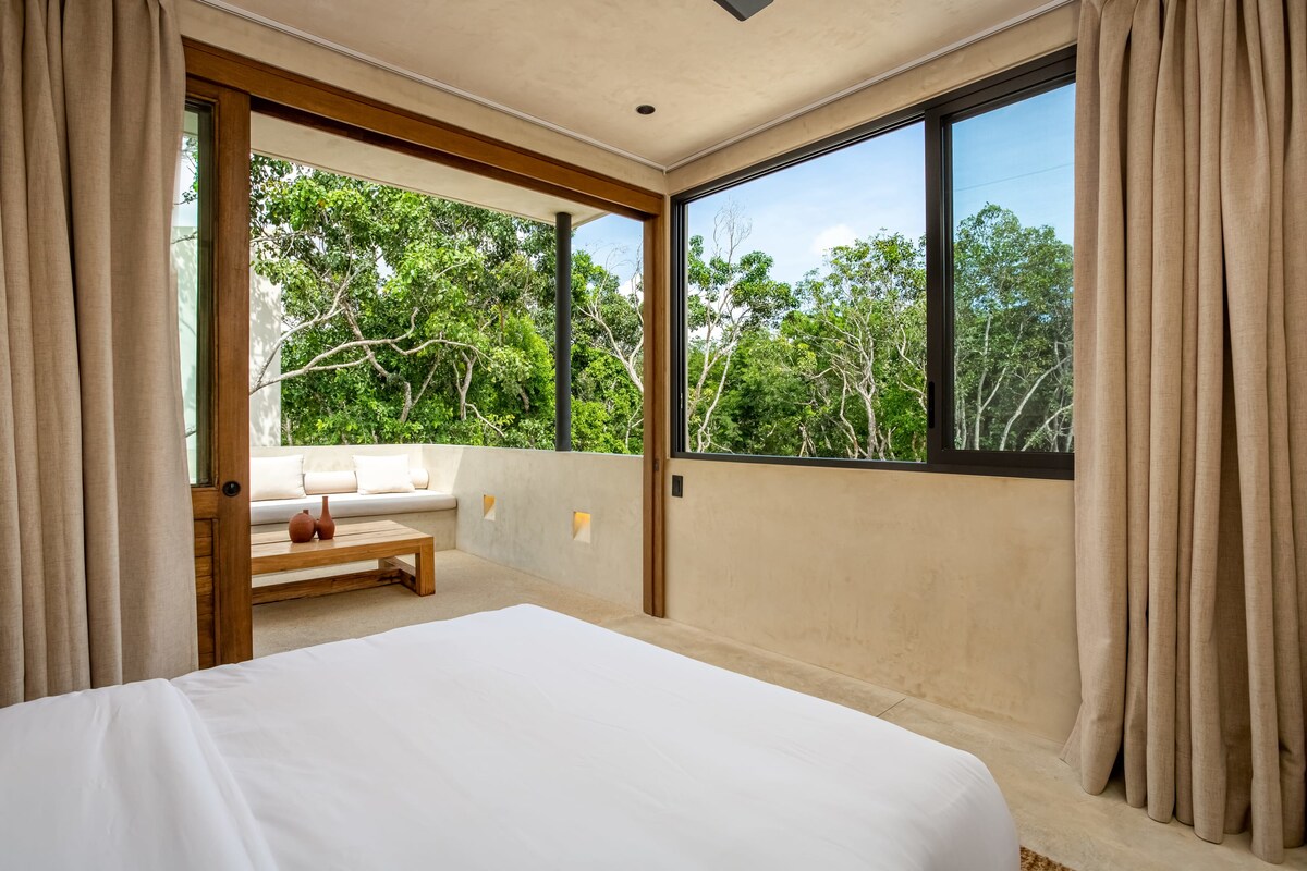 Living room evening ambiance with warm lighting at Luxury Jungle VIBE Tulum