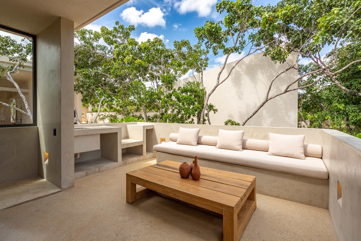 AMARI Uptown Tulum luxury villa illuminated under a starlit jungle sky