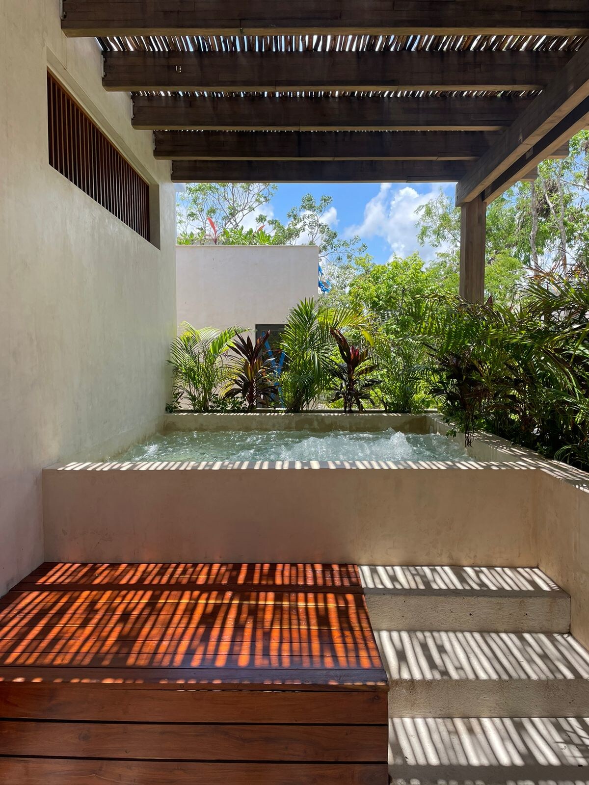 Villa entrance with lush jungle landscaping at AMARI Uptown Tulum