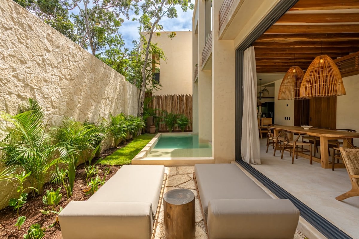 Private swimming pool surrounded by lush tropical vegetation at Luxury Jungle VIBE Tulum